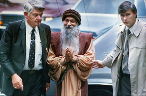 Federal marshals escort Osho to a bail hearing in Charlotte, N.C., in November 1985 following his arrest. He is indicted on federal immigration charges.  